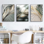 Load image into Gallery viewer, Three nordic golden palm leaf wall art prints hanging above a desk and chair
