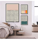 Load image into Gallery viewer, Three minimalist multicoloured wall art prints hanging by a bed
