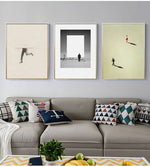 Load image into Gallery viewer, Three contemporary nordic figure wall art prints hanging above a grey sofa
